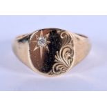 AN ANTIQUE 9CT GOLD SIGNET RING INSET WITH A DIAMOND. Size V, weight 5.74g