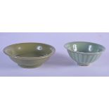 TWO EARLY CHINESE CELADON BOWLS Song/Ming, one with moulded body. Largest 12.5 cm diameter. (2)