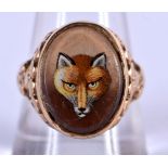 AN ANTIQUE 9CT GOLD RING, INSET WITH A PICTURE OF A FOX. Size R, weight 6.18g