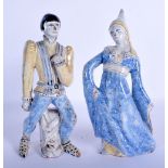 A PAIR OF CONTINENTAL FAIENCE GLAZED POTTERY FIGURES modelled as theatrical characters. 22 cm high.