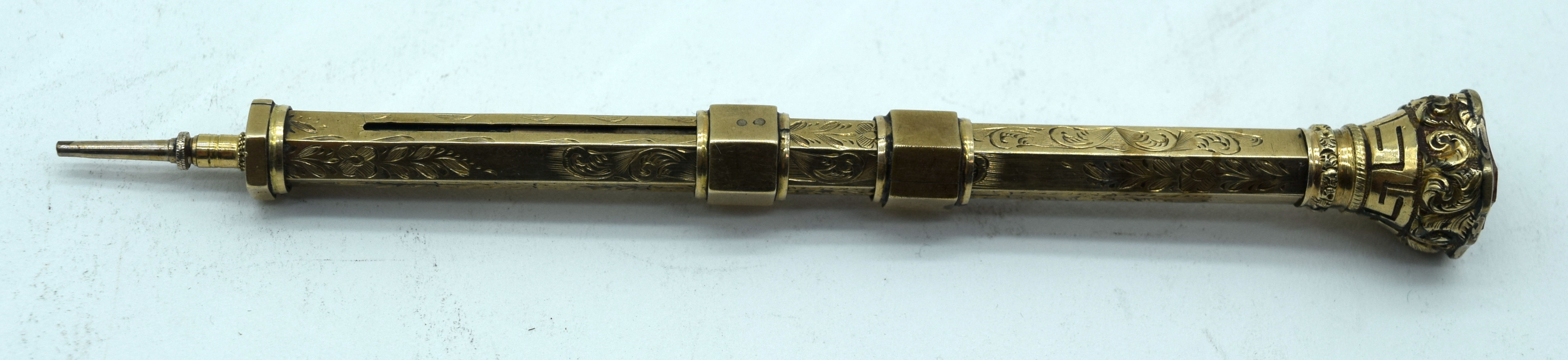 An unusual antique gilt metal combined retractable fountain pen and pencil and a seal 10cm.