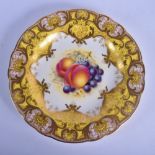Royal Worcester plate painted with fruit under a pale yellow and gilt ground by J. Freeman signed, d