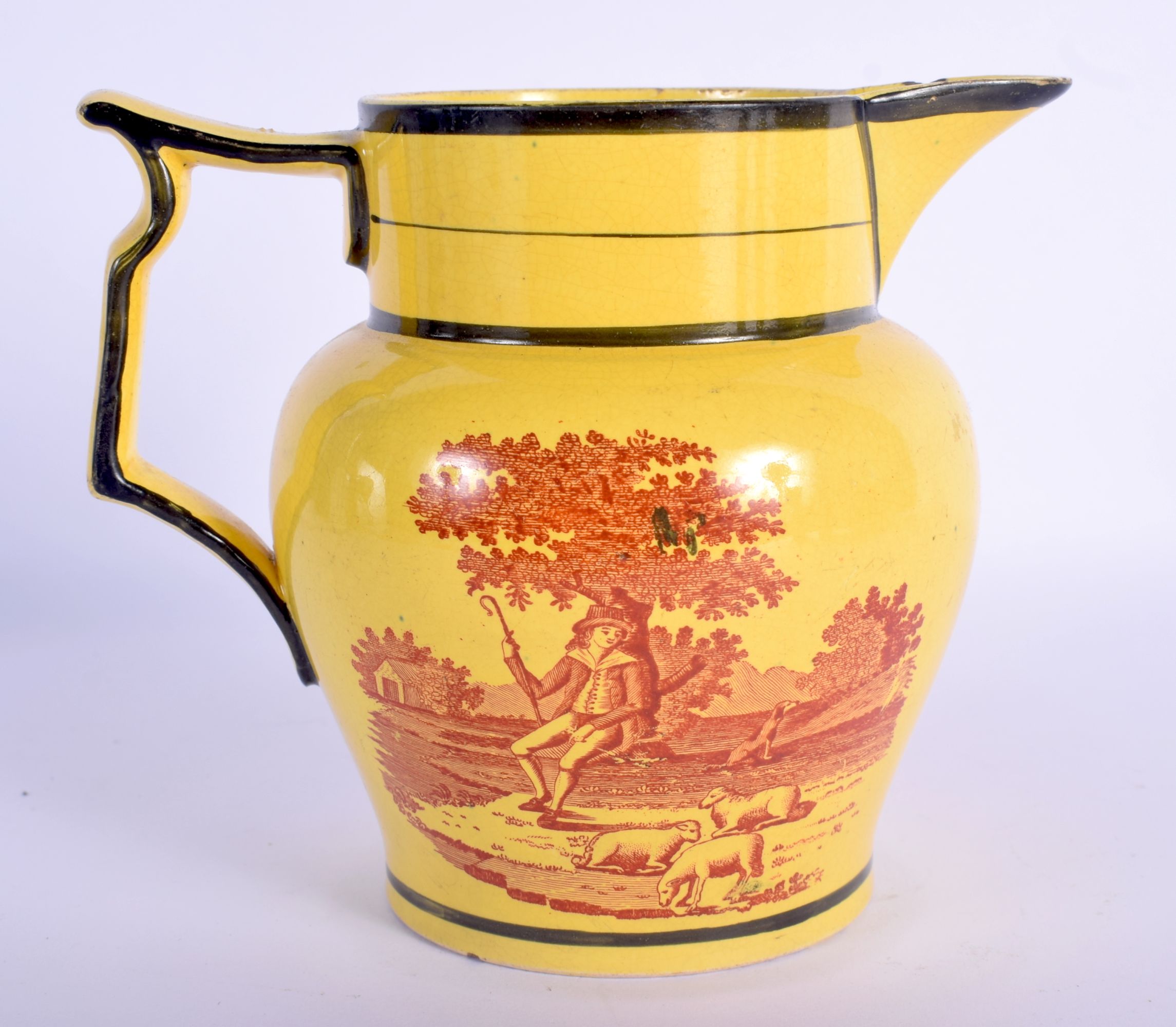 A RARE EARLY 19TH CENTURY CANARY YELLOW POTTERY JUG printed with red landscapes. 13 cm x 13 cm.