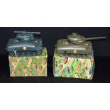 A boxed Tri-ang Sherman tank, together with another boxed Sherman tank. Box size 21 x 12cm (2)