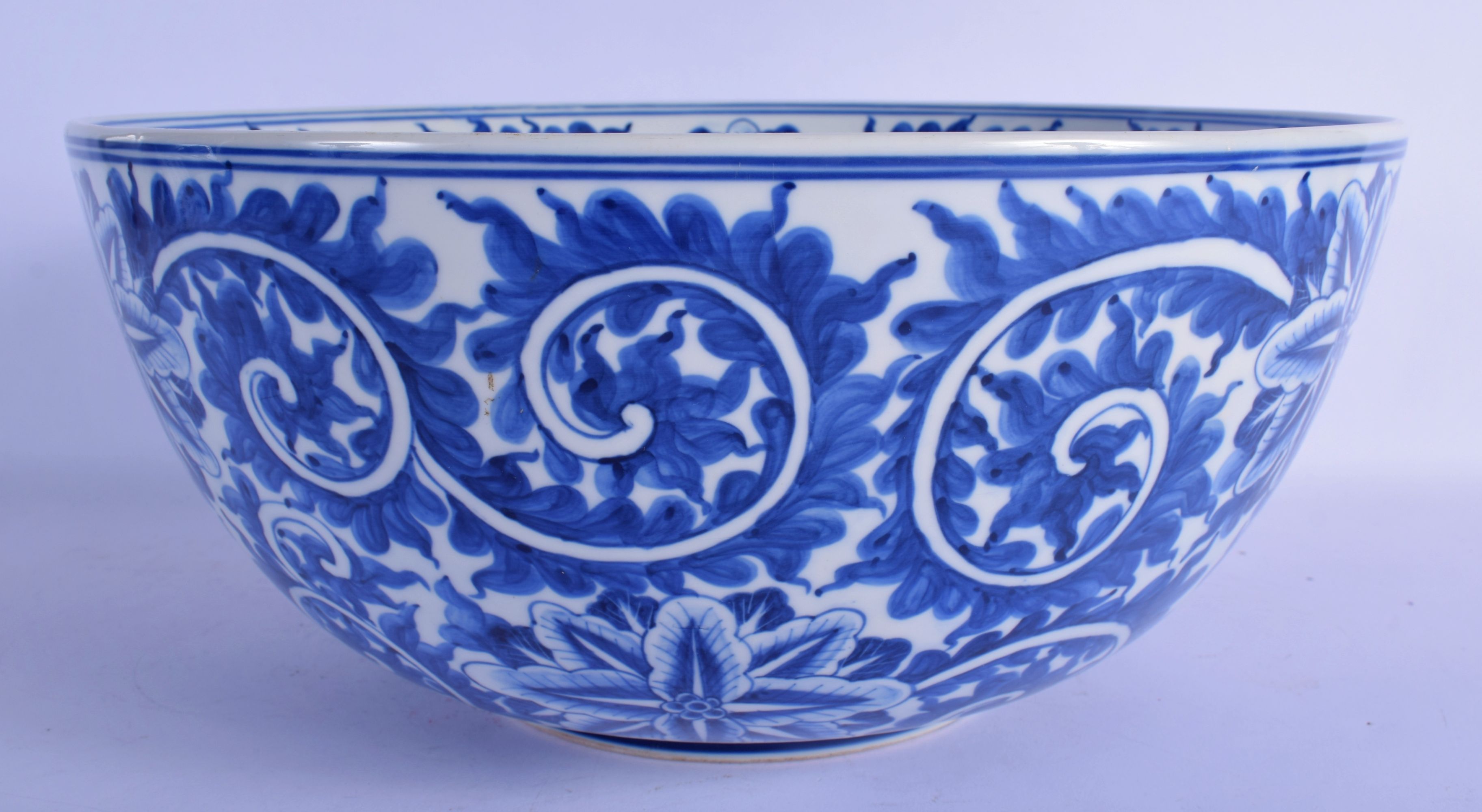 A LARGE 19TH CENTURY CONTINENTAL BLUE AND WHITE PORCELAIN BOWL well painted with bold floral sprays. - Image 2 of 5