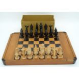 A Tribal African Village chess set together with a Travelling part chess set, drafts and board 38 x