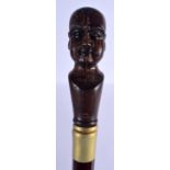 A CONTEMPORARY CARVED WOOD PHRENOLOGY HEAD WALKING CANE. 90 cm long.