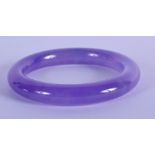 A 20TH CENTURY CHINESE CARVED ICY LAVENDER BANGLE . 8cm Diameter