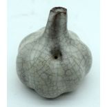 A small Chinese porcelain crackle glazed garlic water dropper. 7cm.