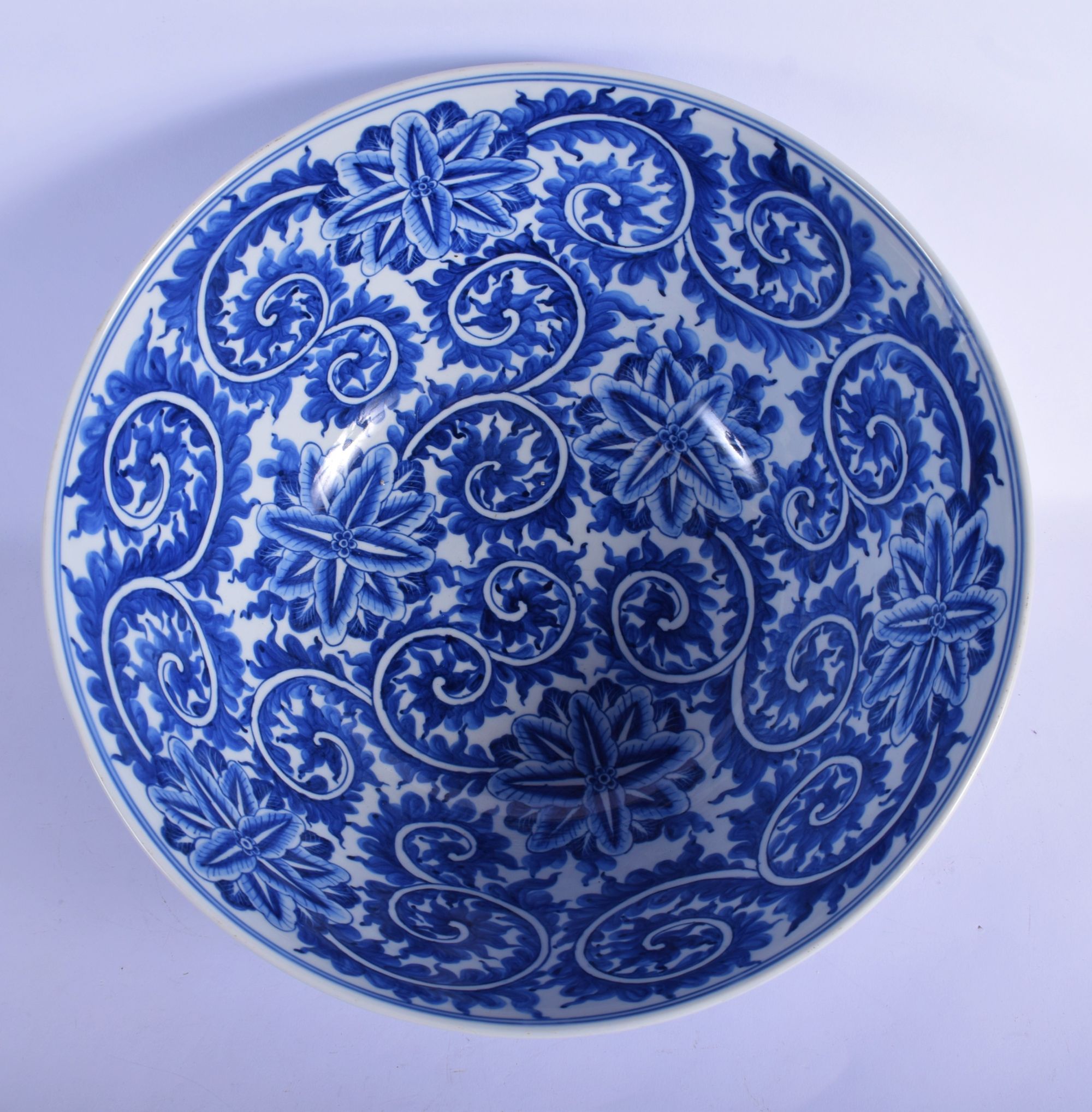 A LARGE 19TH CENTURY CONTINENTAL BLUE AND WHITE PORCELAIN BOWL well painted with bold floral sprays. - Image 4 of 5