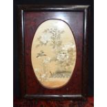 A framed Chinese silk depicting birds in foliage.54 x 36 cm.