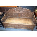 A 19TH CENTURY ANGLO CHINESE BURMESE CARVED WOOD SETTLE decorated with dragons. 150 cm x 120 cm x 60