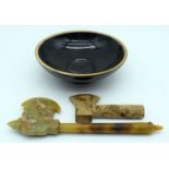 A small Chinese jade axe carved in the form of a dragon together with a smaller carved hardstone axe