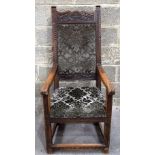 A 18/19th century carved wooden carver chair with upholstered back and seat. 126 x 59 x 55cm