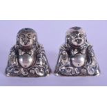 A PAIR OF CHINESE SILVER CONDIMENTS IN THE FORM OF BUDDHA. 4cm x 4.5cm x 2.5cm, weight 43g