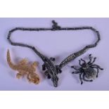 A BUTLER AND WILSON SPIDER BROOCH together with two very simlar items. 109 grams. Largest 45 cm long