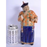 A CHINESE PORCELAIN FIGURE OF A STANDING MANDARIN 20th Century. 25 cm high.