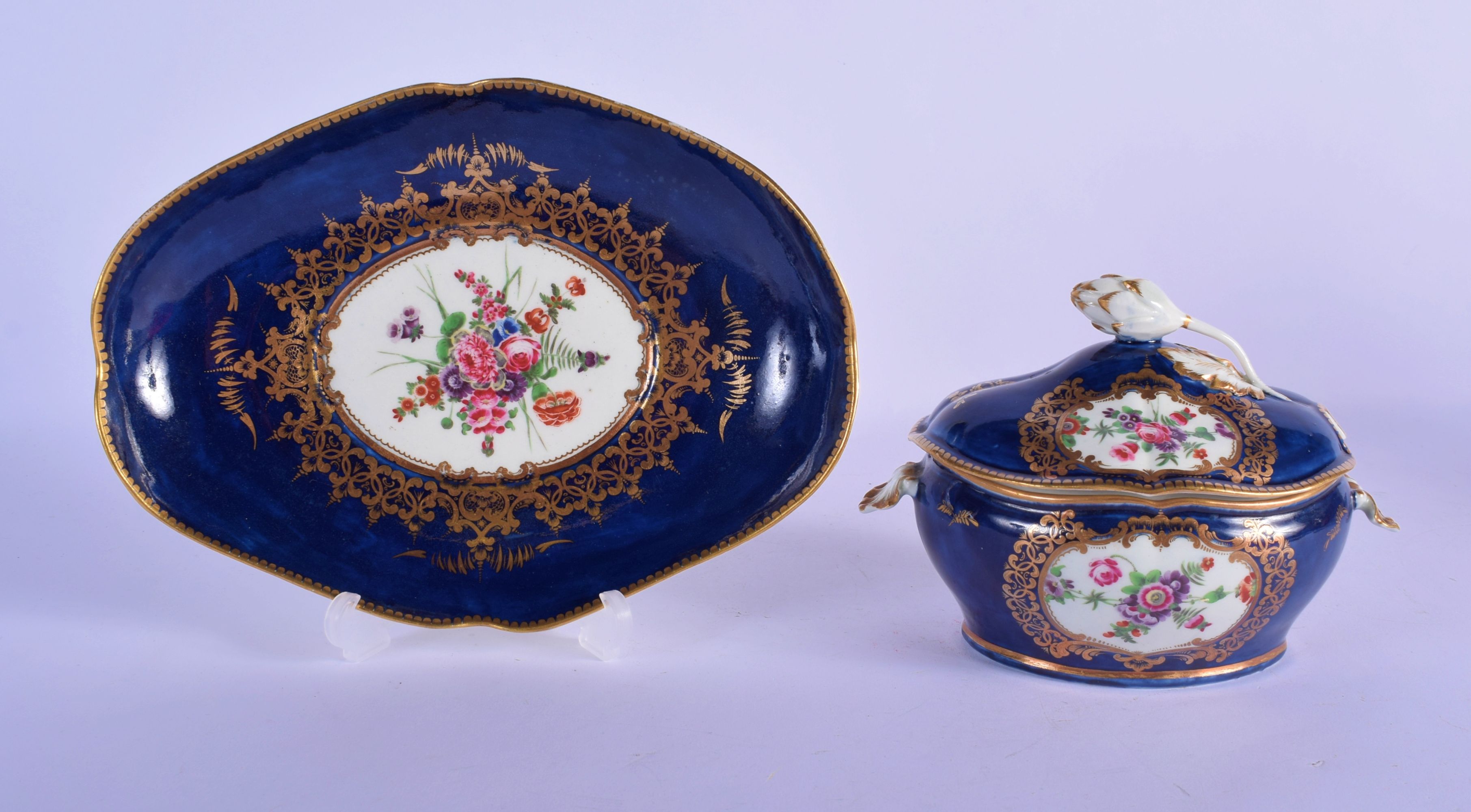 Worcester sauce tureen and cover with stand c.1770-75, the oval form painted with panels of polychro