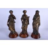 A SET OF THREE 19TH CENTURY FRENCH BRONZE FIGURES modelled upon wooden bases. 27 cm high. (3)