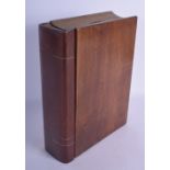 AN EDWARDIAN NOVELTY CARVED WOOD BOOK MONEY BOX. 23 cm x 18 cm.