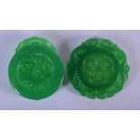 TWO CHINESE SPINACH JADE PLAQUES 20th Century. 5 cm wide. (2)