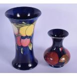 TWO MOORCROFT VASES. Largest 20.5 cm high. (2)