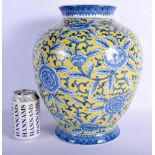A LARGE CHINESE BLUE AND WHITE PORCELAIN VASE 20th Century, painted with flowers upon a yellow groun