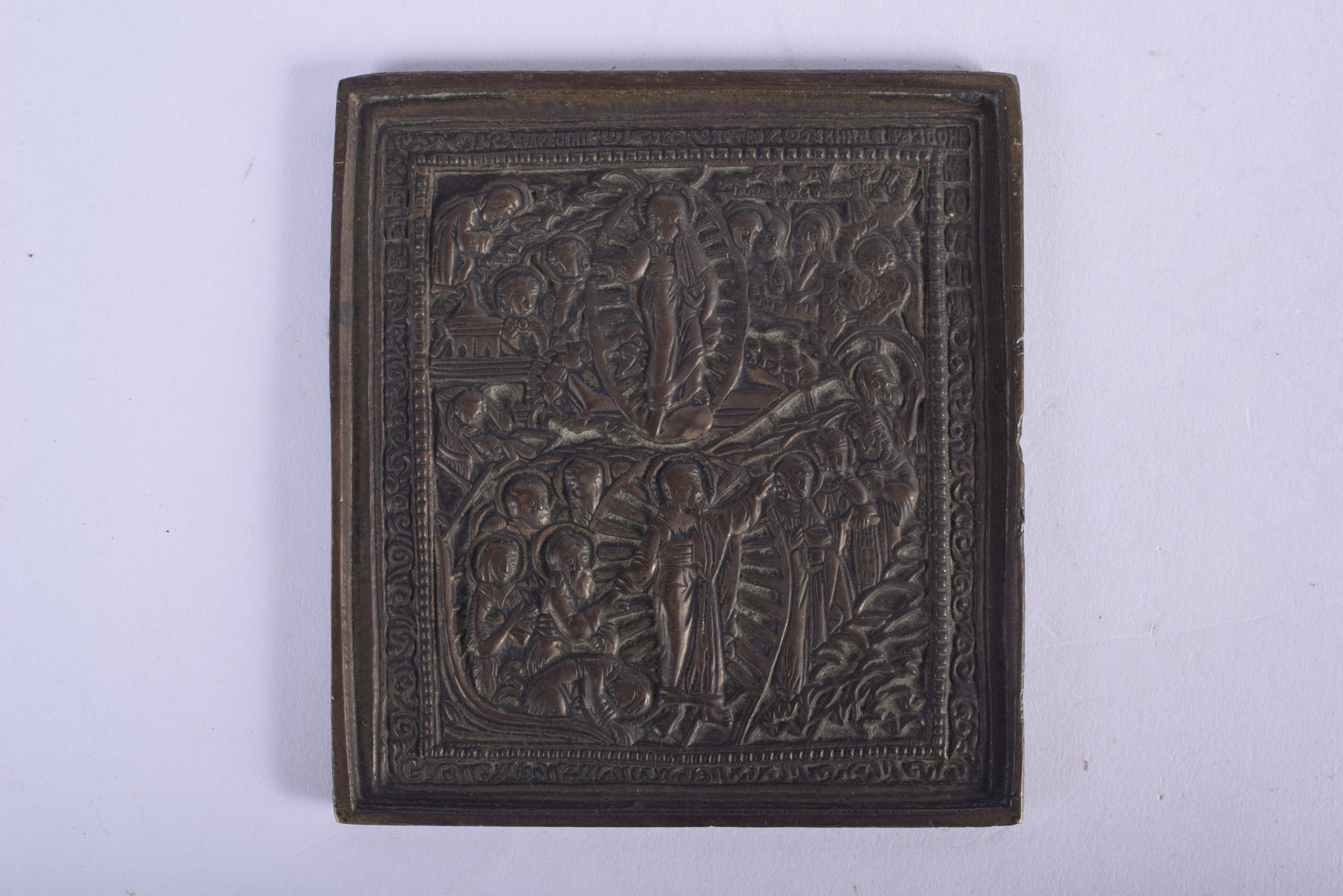 AN ANTIQUE RUSSIAN EUROPEAN BRONZE ICON decorated with saints. 9.5 cm square.