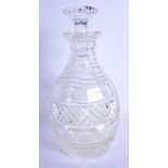 A GEORGE III CUT GLASS DECANTER AND STOPPER. 25.5 cm high.