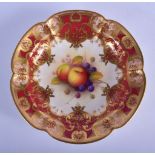 Royal Worcester large scalloped circular dish painted with fruit under a crimson ground border by A.