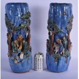 A RARE PAIR OF EARLY 20TH CENTURY CHINESE BLUE GLAZED STONEWARE VASES decorated with figures in vari