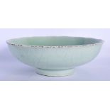 AN 18TH/19TH CENTURY CHINESE CELADON BARBED BOWL Qing, of naturalistic form. 18 cm wide.