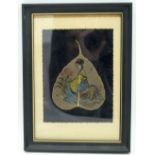 A framed Japanese leaf picture of a female 18 x 13cm