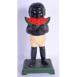 A CHARMING VINTAGE CAST IRON MONEY BANK modelled as a young boy munching on a water melon. 25 cm hig