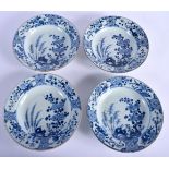 A SET OF FOUR EARLY 18TH CENTURY CHINESE BLUE AND WHITE PORCELAIN BOWLS Yongzheng, painted with holl