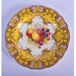 Royal Worcester plate painted with fruit under a pale yellow and gilt ground by E. Townsend signed,