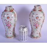 A LARGE PAIR OF 18TH CENTURY CHINESE EXPORT PORCELAIN VASES Qianlong, painted with flowers and overl