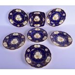 Late 19th / Early 20th c. Coalport set of six plates and a square dish painted with birds in gilt ca