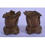 A CHINESE MINIATURE PAIR OF BRONZE CAULDRONS DECORATED WITH LEAVES AND INSECTS. Cauldron 4.5cm high