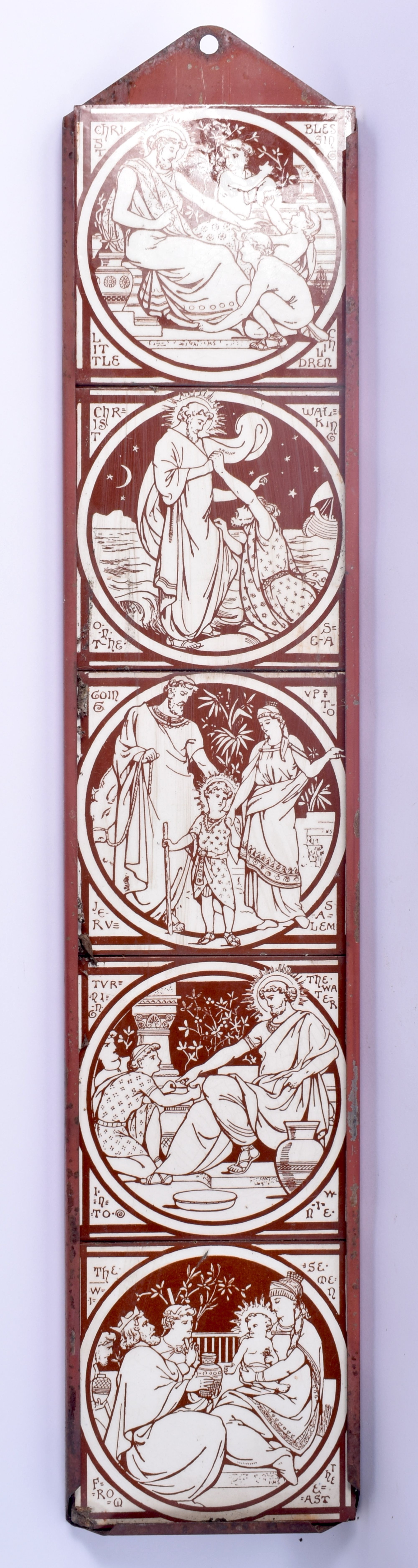 A SET OF ARTS AND CRAFTS MINTON TILES within a metal frame, decorated with figures. Each tile 15 cm