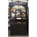 A 19TH CENTURY CHINESE CARVED HARDWOOD HONGMU DISPLAY CABINET Qing, decorated with foliage. 190 cm x
