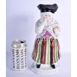 A RARE 18TH/19TH CENTURY STAFFORDSHIRE PEARLWARE MARTHA GUNN CHARACTER JUG modelled taking snuff. 27