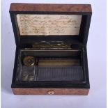 AN ANTIQUE SIX AIRS BURR WALNUT MUSICAL BOX. 12 cm x 7.5 cm.