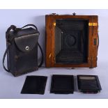 AN ANTIQUE PHOTOGRAPHIC WOOD CAMERA with plates. 25 cm square. (qty)