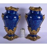 A FINE PAIR OF 19TH CENTURY FRENCH BLUE PORCELAIN VASES overlaid with gilt bronze acanthus mounts. 4