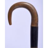 A RARE 19TH CENTURY CONTINENTAL CARVED RHINOCEROS HORN BANDED WALKING CANE of tapering form. 679 gra