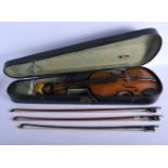 A CASED VIOLIN with three bows. 58 cm long. (4)