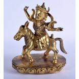 A CHINESE TIBETAN GILT BRONZE FIGURE OF A MALE 20th Century, modelled upon a horse. 24 cm x 16 cm.