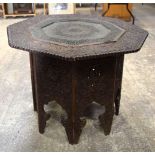 A 19th Century carved wooden Indian table with an open work metal tray insert . 5.7 x 77cm