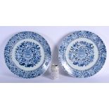 A LARGE PAIR OF EARLY 18TH CENTURY CHINESE BLUE AND WHITE CHARGERS Kangxi/Yongzheng, painted with fl